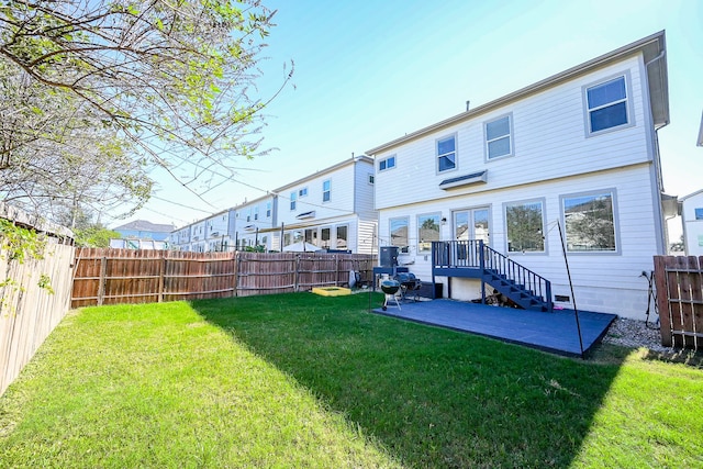 back of property with a yard and a patio