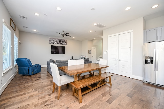 dining room featuring ceiling fan and wood-type flooring