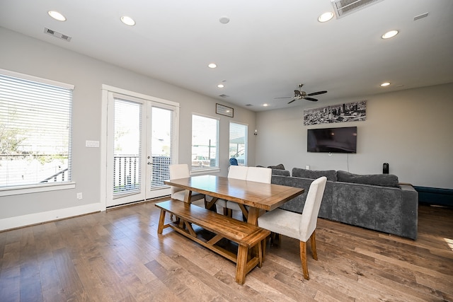 dining room featuring ceiling fan, french doors, and wood-type flooring