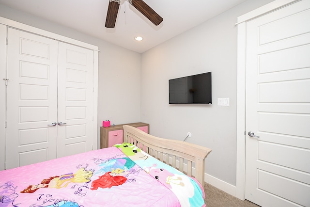 bedroom featuring carpet, ceiling fan, and a closet