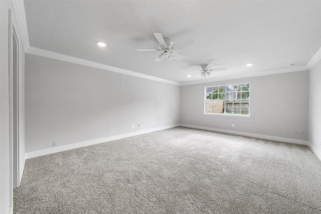 spare room with carpet flooring, ceiling fan, and crown molding