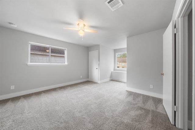 unfurnished bedroom with light carpet and ceiling fan