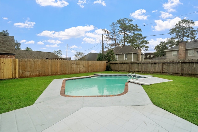 view of pool featuring a patio area and a lawn