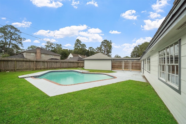 view of pool with a patio area and a lawn