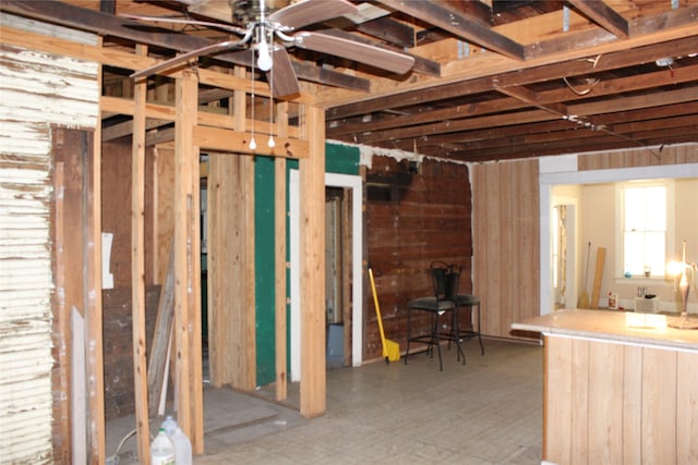 basement featuring a ceiling fan