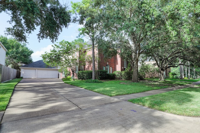 view of front of property with a garage and a front lawn