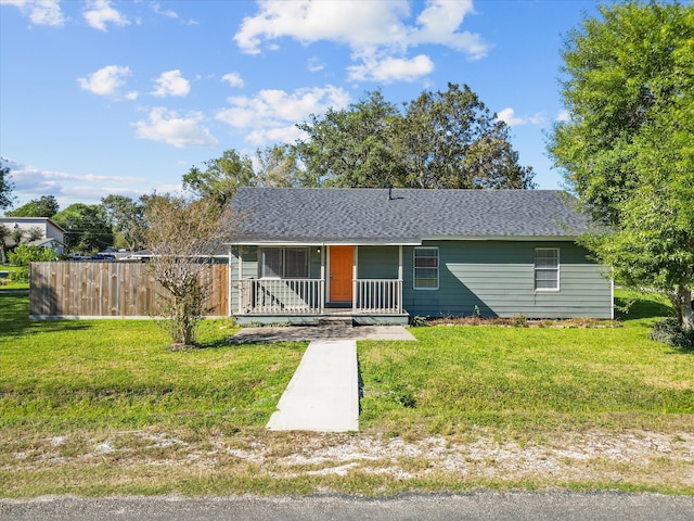 single story home with a front lawn and a porch