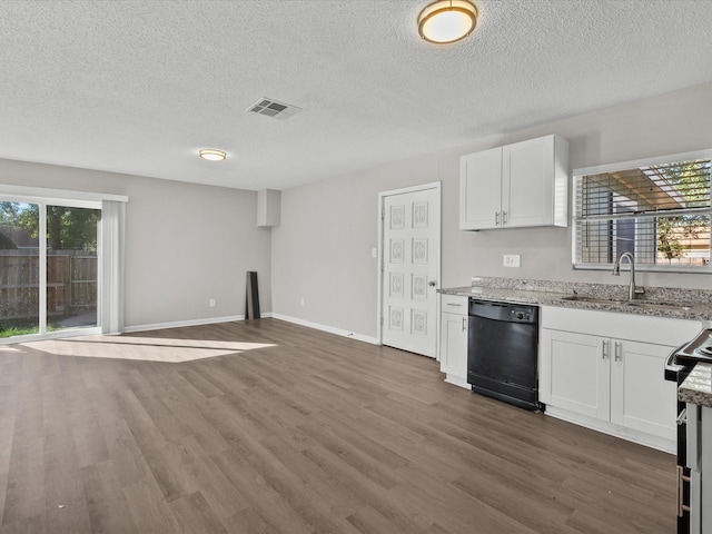 kitchen with white cabinetry, sink, black dishwasher, dark hardwood / wood-style floors, and a textured ceiling