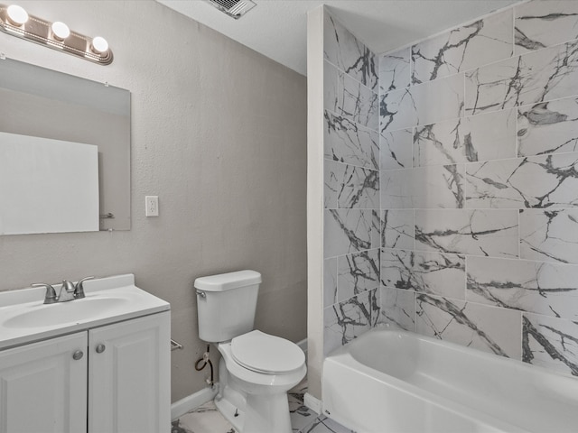 full bathroom with vanity, toilet, and tiled shower / bath