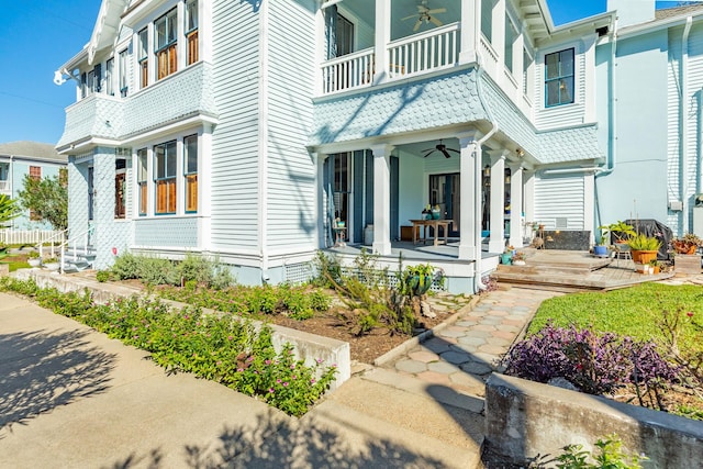 802 16th St, Galveston, TX 77550 - view of exterior entry with a ceiling fan, a balcony, and a porch