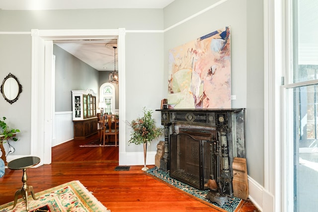 802 16th St, Galveston, TX 77550 - living room with hardwood / wood-style flooring, wainscoting, and a fireplace