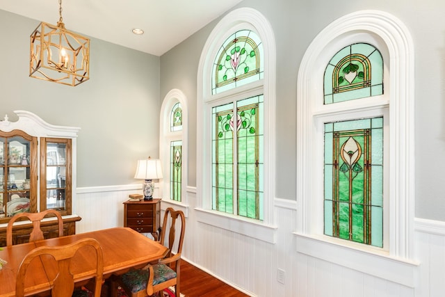 802 16th St, Galveston, TX 77550 - dining area with a wainscoted wall, a chandelier, dark wood finished floors, and plenty of natural light