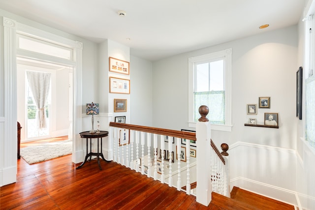 corridor with hardwood / wood-style floors