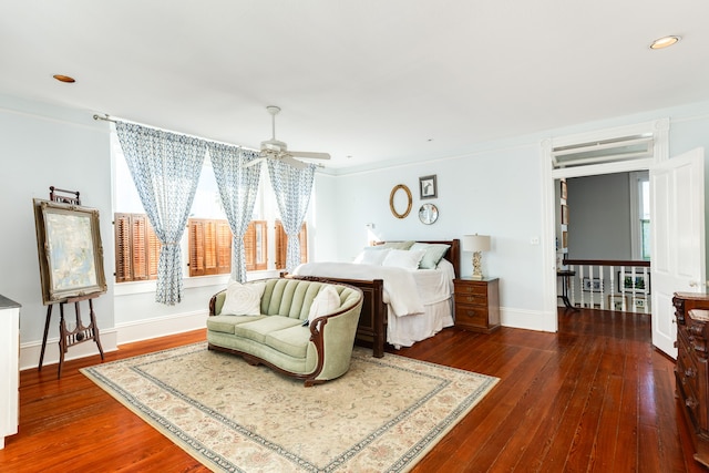 bedroom featuring ceiling fan, dark hardwood / wood-style flooring, and crown molding