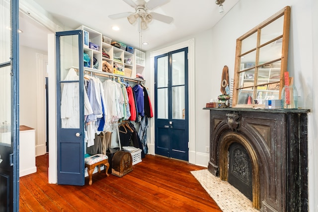 interior space featuring ceiling fan and dark hardwood / wood-style flooring