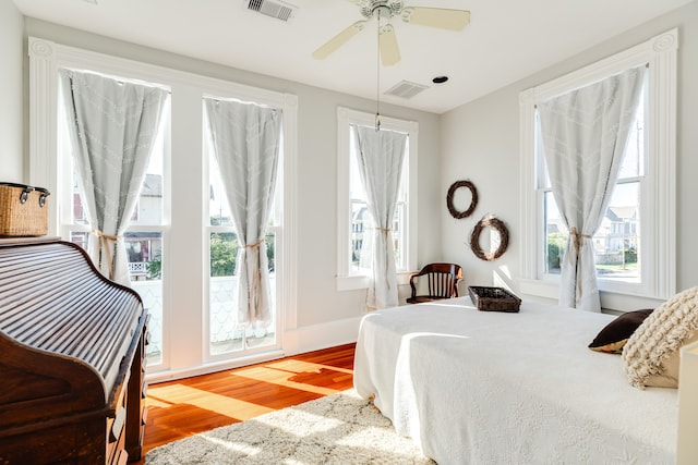 bedroom featuring hardwood / wood-style flooring and ceiling fan