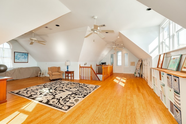 bonus room featuring ceiling fan, light wood-type flooring, and vaulted ceiling