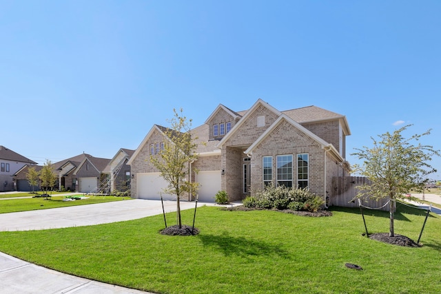 view of front facade with a front yard and a garage