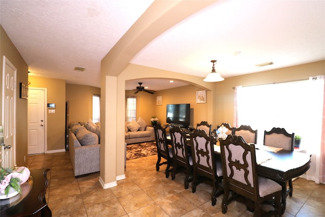 dining room featuring tile patterned flooring and ceiling fan