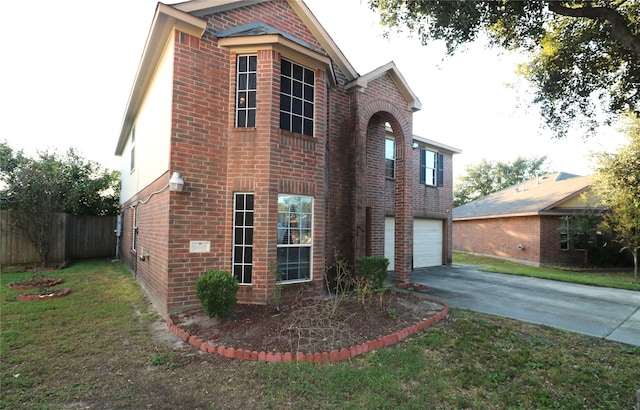 view of home's exterior with a yard and a garage