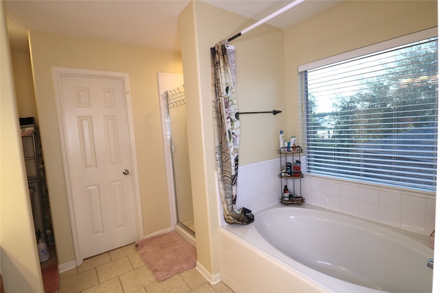 bathroom featuring separate shower and tub and tile patterned flooring