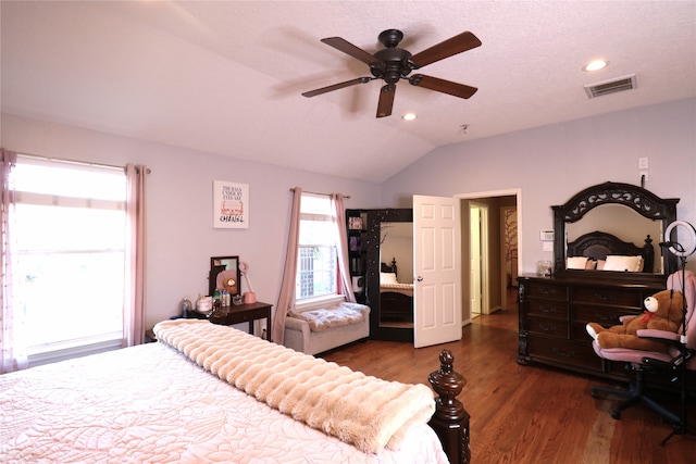 bedroom featuring ceiling fan, dark wood-type flooring, and vaulted ceiling