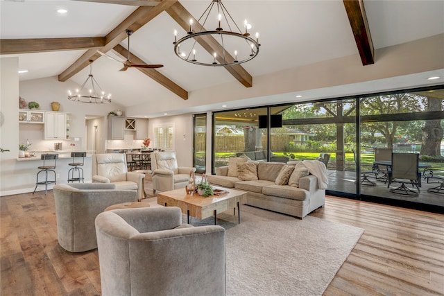 living room with wood-type flooring, high vaulted ceiling, ceiling fan, and beam ceiling