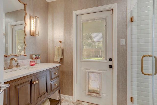 bathroom with vanity and walk in shower