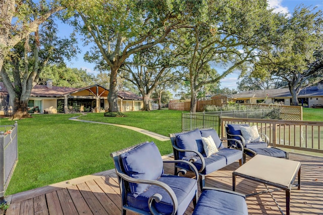 wooden terrace featuring outdoor lounge area and a yard