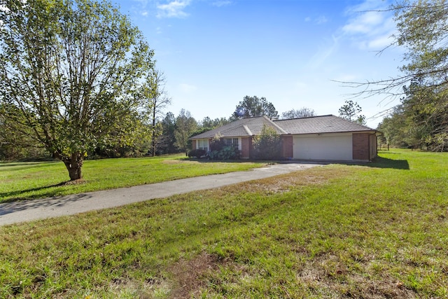 ranch-style home with a garage and a front lawn