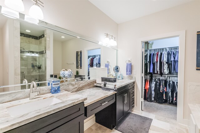 bathroom with vanity, tile patterned floors, and a shower with shower door