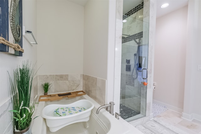 bathroom featuring tile patterned flooring and plus walk in shower