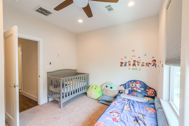 carpeted bedroom featuring ceiling fan