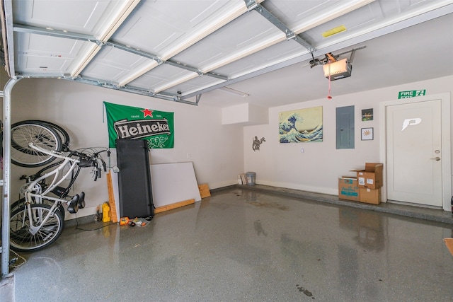 garage with electric panel and a garage door opener