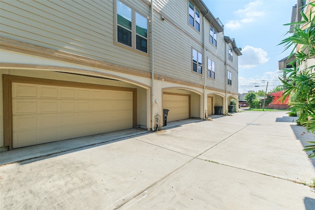 view of side of property with a garage