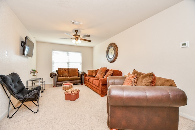 living room featuring light carpet and ceiling fan