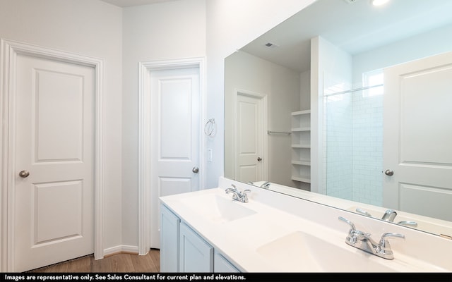 bathroom with vanity and wood-type flooring