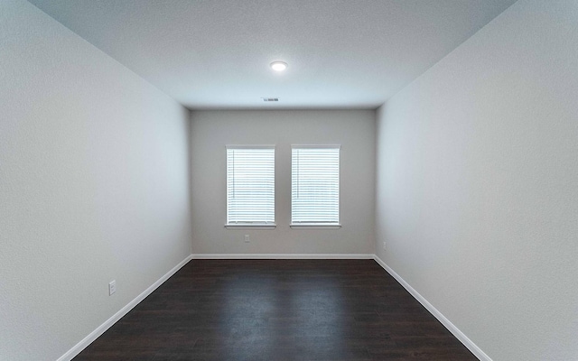 13101 Sapphire Lake Ln, Texas City, TX 77568 - spare room with dark wood-style flooring and baseboards