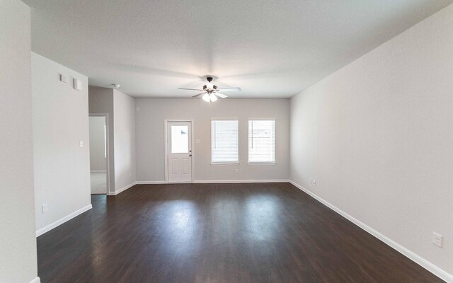 13101 Sapphire Lake Ln, Texas City, TX 77568 - spare room with ceiling fan, dark wood-style flooring, and baseboards