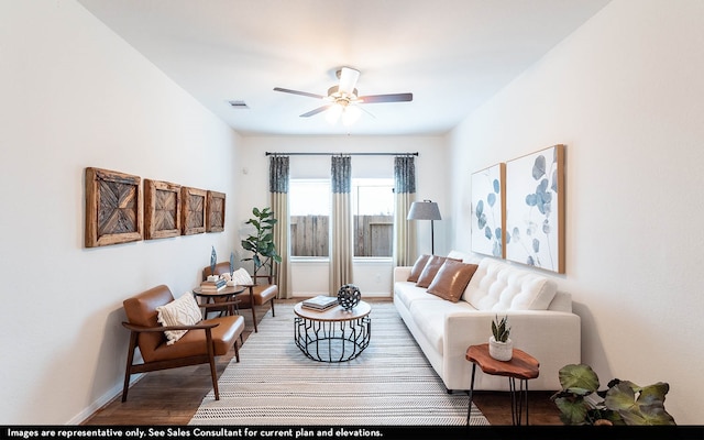 living room featuring hardwood / wood-style flooring and ceiling fan