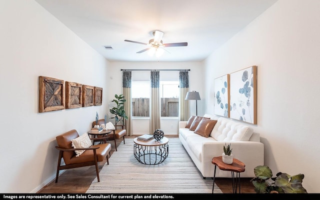 living room featuring ceiling fan and hardwood / wood-style floors