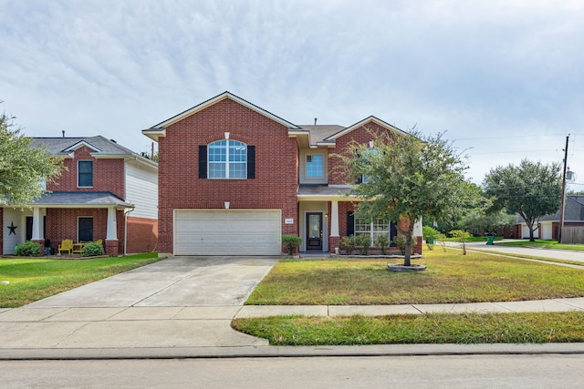 view of front of house featuring a garage and a front lawn