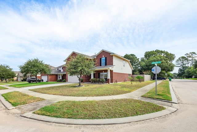 view of front of house with a garage and a front lawn