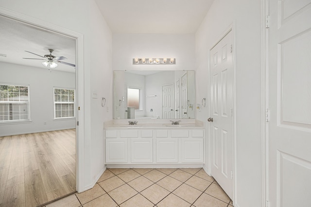 bathroom featuring hardwood / wood-style floors, vanity, and ceiling fan