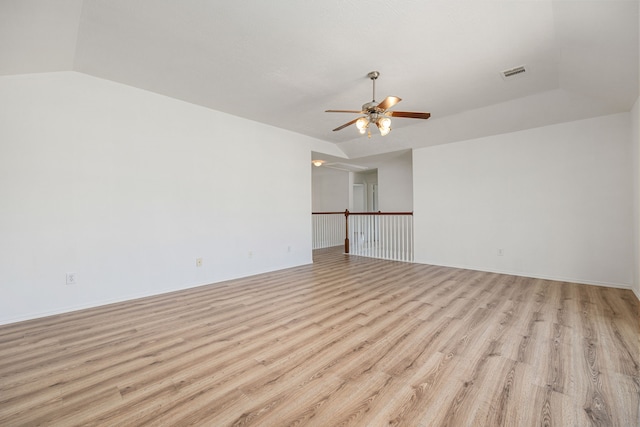 unfurnished room featuring ceiling fan, lofted ceiling, and light hardwood / wood-style flooring