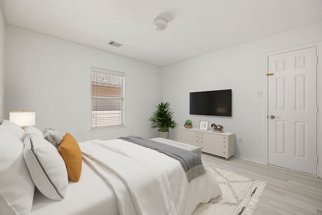 bedroom with light hardwood / wood-style flooring