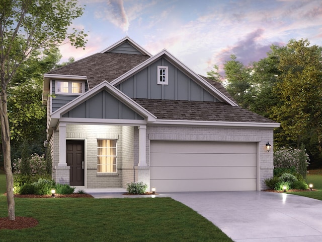 craftsman inspired home with a garage and a yard