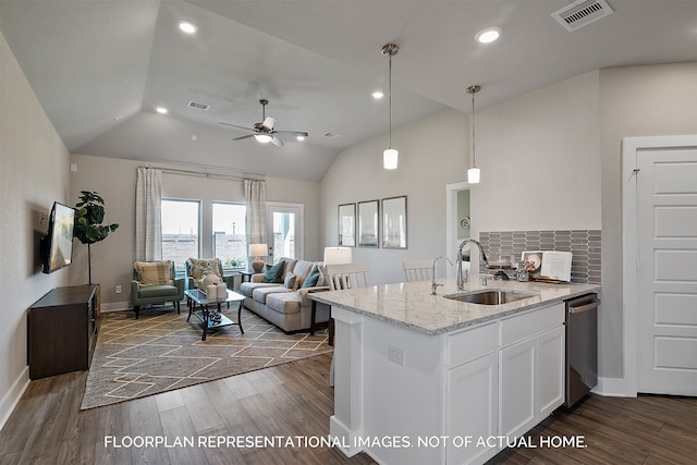 kitchen featuring sink, pendant lighting, dishwasher, dark hardwood / wood-style floors, and white cabinetry