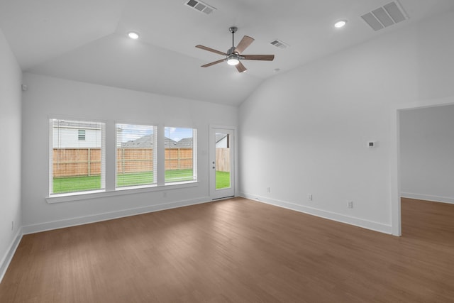 empty room featuring ceiling fan, visible vents, and lofted ceiling