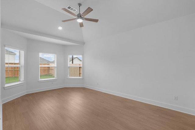 unfurnished room with a ceiling fan, baseboards, visible vents, and light wood-style floors